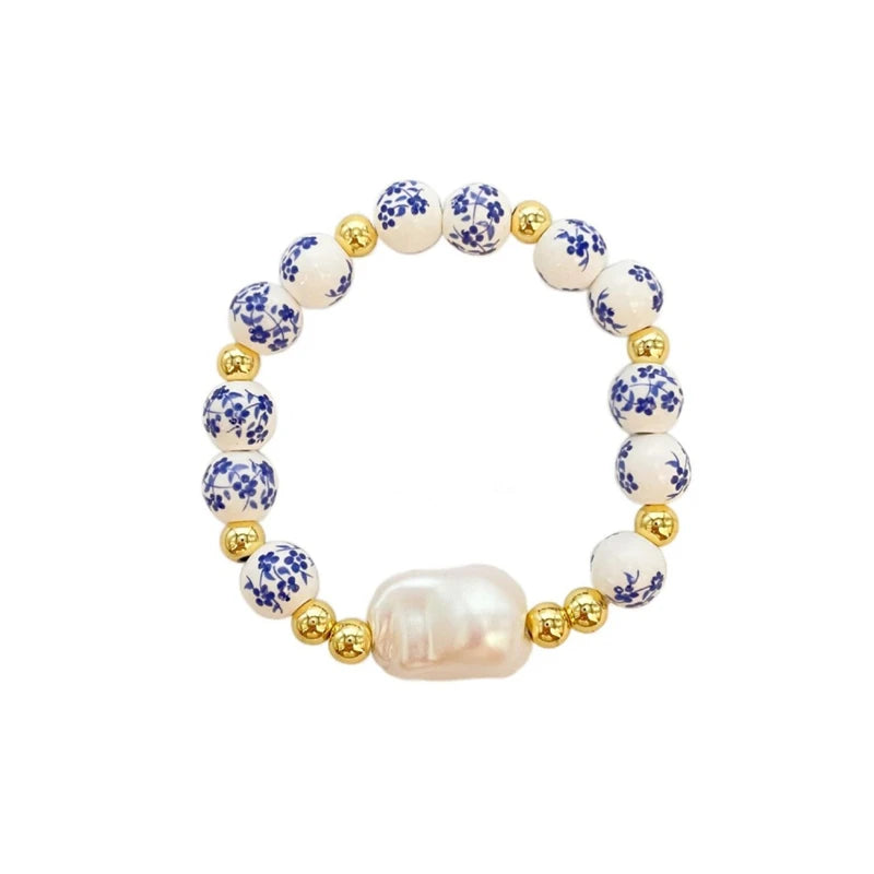 Bracelet with pearls and floral beads on a white background
