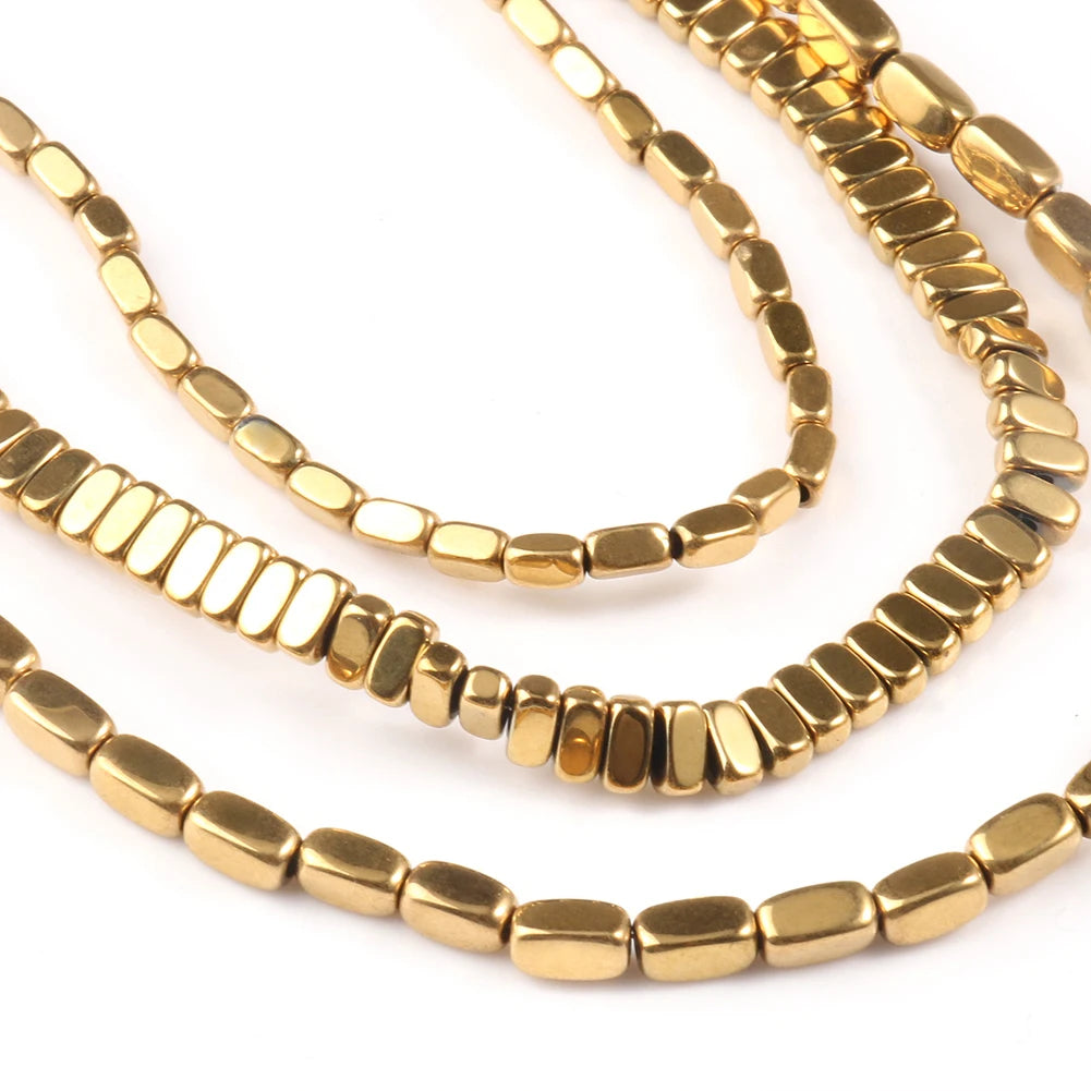 Gold beaded necklaces on a white background