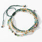 Multistrand beaded bracelet with colorful beads on a white background