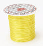 Spool of yellow thread with a brand label on a white background