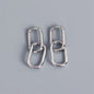 Pair of silver hoop earrings on a gray background