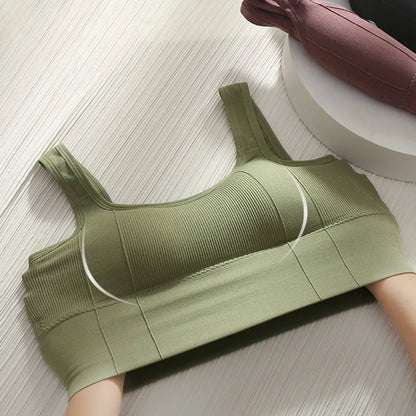 Green ribbed tank top on a light wooden floor