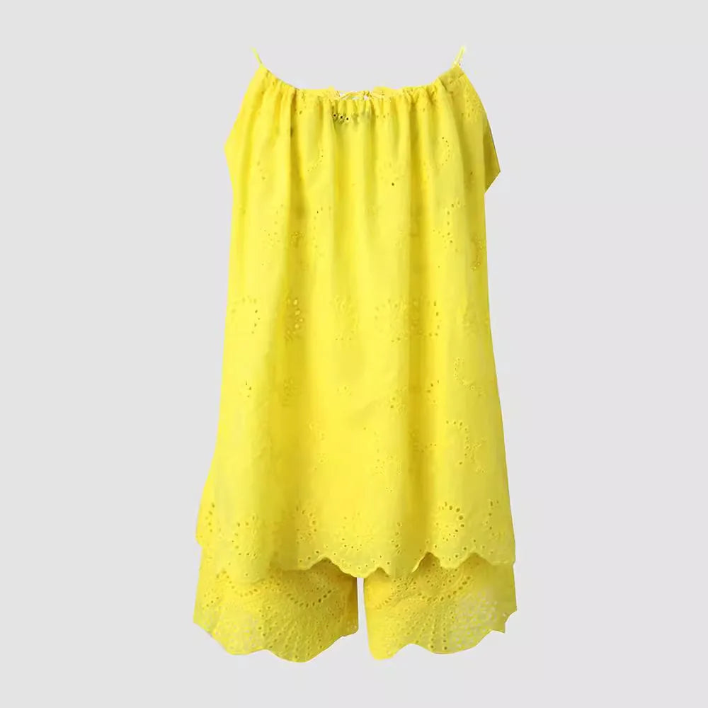 Yellow off-shoulder top with eyelet details on a light gray background