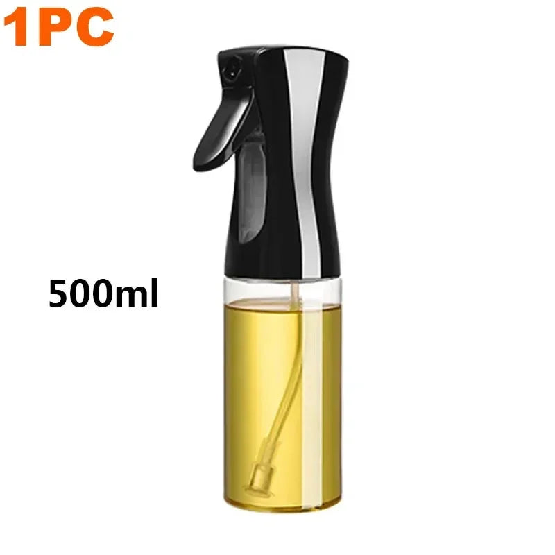 Spray bottle with black nozzle and clear body containing oil, labeled '500ml' on a white background.