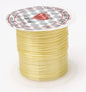 Spool of yellow thread with a silver label on a white background