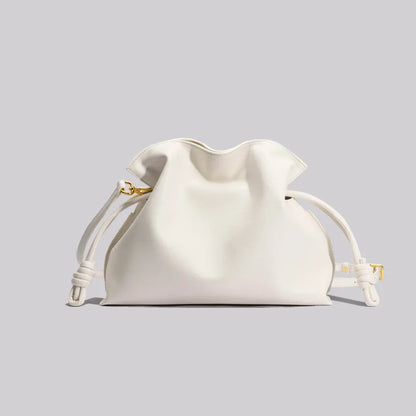 White drawstring bag on a light gray background
