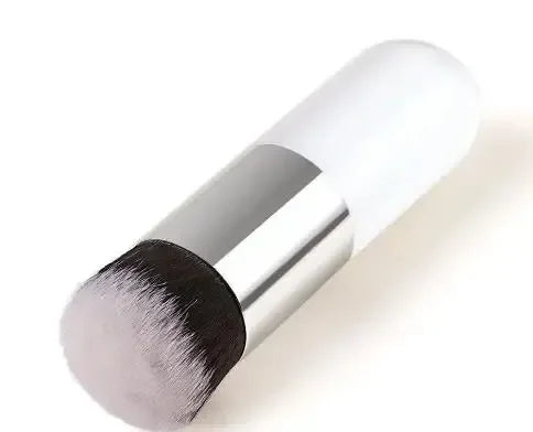Makeup brush with black bristle tip on a white background