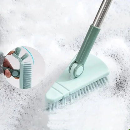 Green cleaning brush with a flexible shaft being used on a soapy surface.