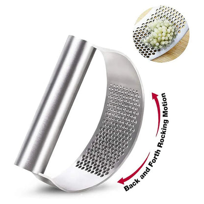 Metal garlic press with a close-up of crushed garlic and instructions on use.