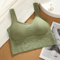 Green ribbed tank top on a cork surface with a magazine underneath