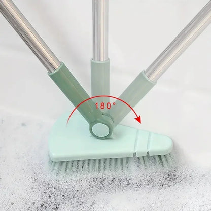 Green cleaning brush with adjustable head on a white background