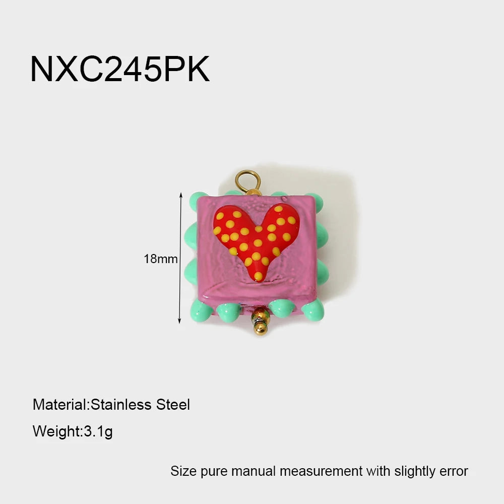 Small pink charm with a heart design on a white background, featuring dimensions and material information.