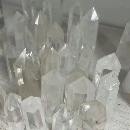 Close-up of clear crystal formations on a white surface