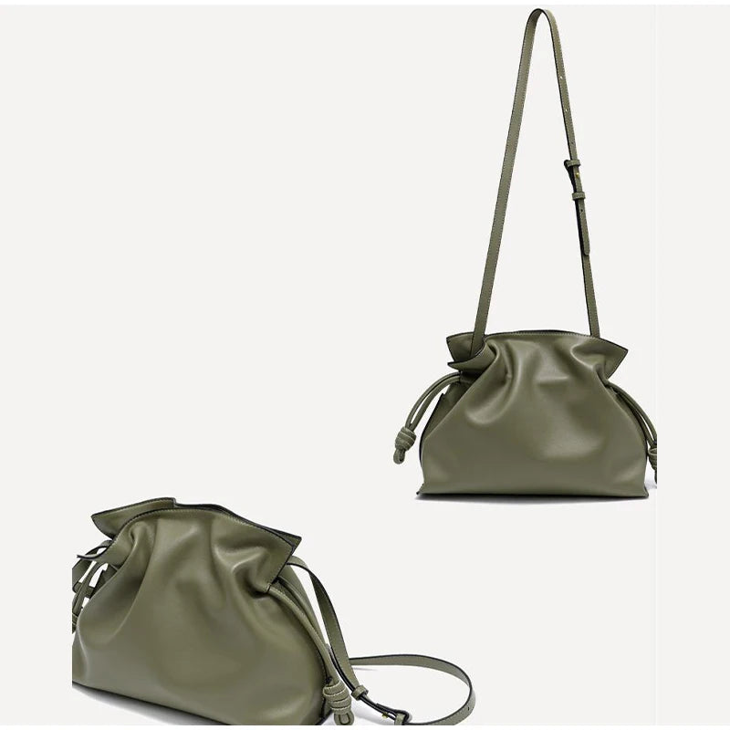 Green leather drawstring bag on a white background