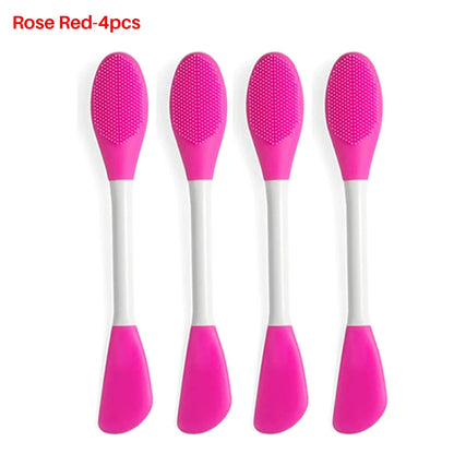 Four rose red silicone brushes with white handles on a white background.