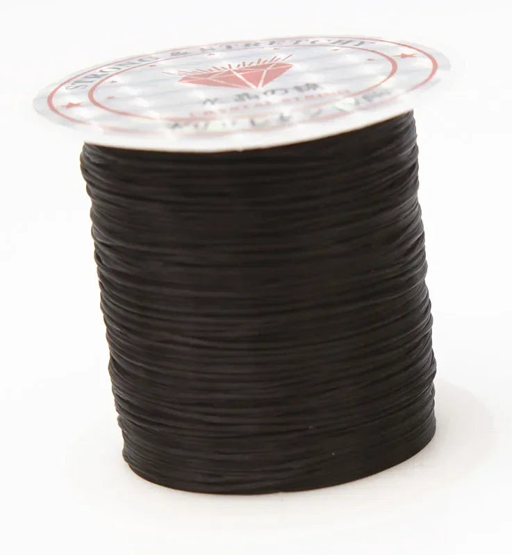 Spool of black cord with a clear label on a white background