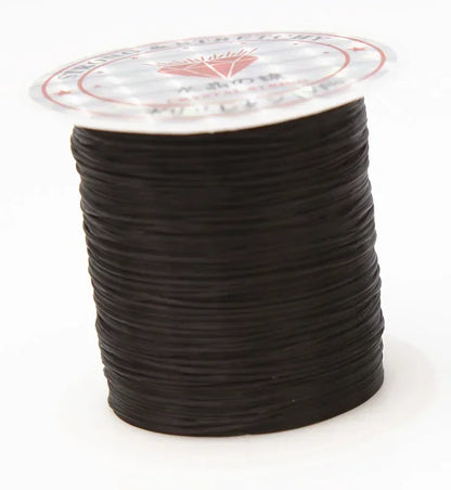 Spool of black cord with a clear label on a white background