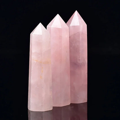 Three pink crystal towers on a black background