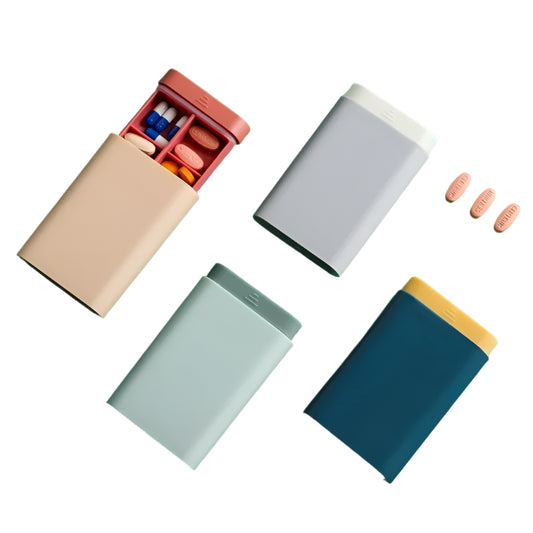 Colorful pill cases on a white background