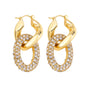 Gold hoop earrings with crystal embellishments on a white background