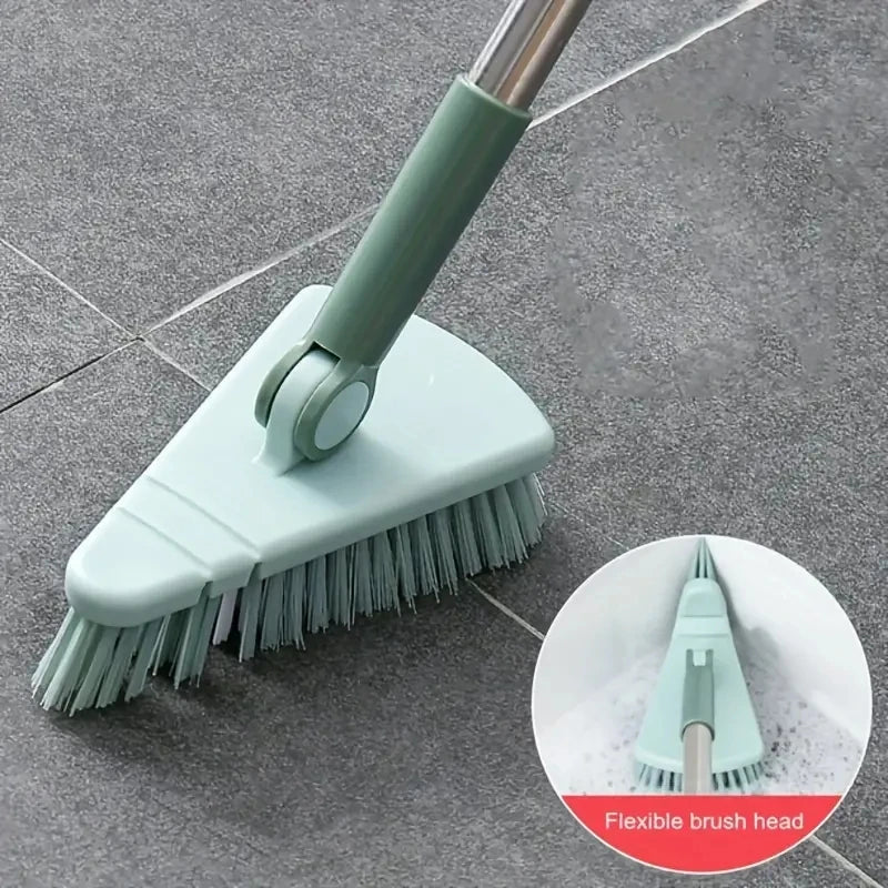 Green cleaning brush with flexible bristle head on a tiled floor
