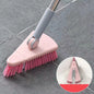 Pink cleaning brush with gray handle on a tiled floor, with an inset showing it cleaning a surface.