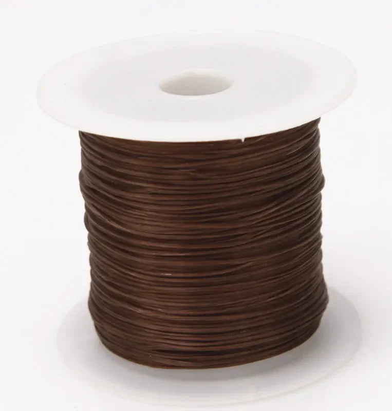 Spool of brown wire on a white background