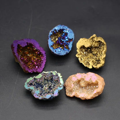 Five colorful geode-like rocks on a dark gray background