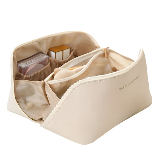 Beige cosmetic bag with compartments on a white surface