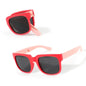 Sunglasses with red and pink frames on a white background