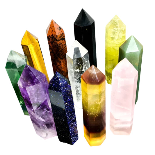 Collection of colorful crystal points on a dark textured background with AierCrystal branding.