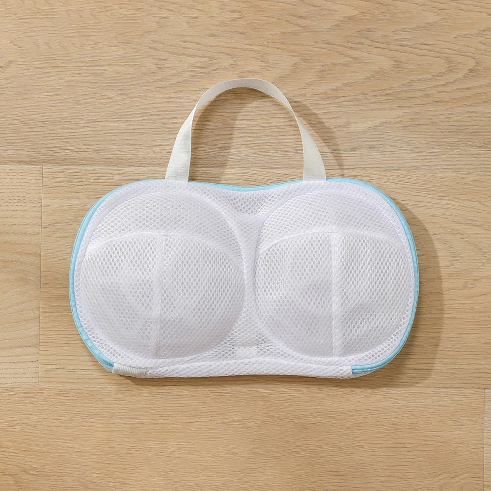 White mesh bra with a handle on a wooden surface