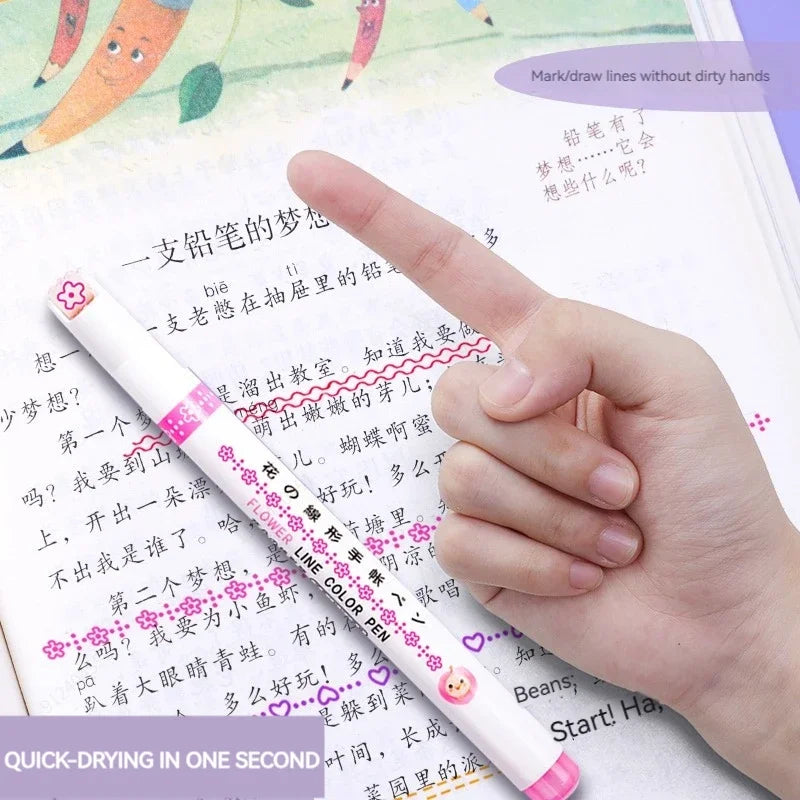 Hand holding a color pen over a book with text and colorful illustrations.