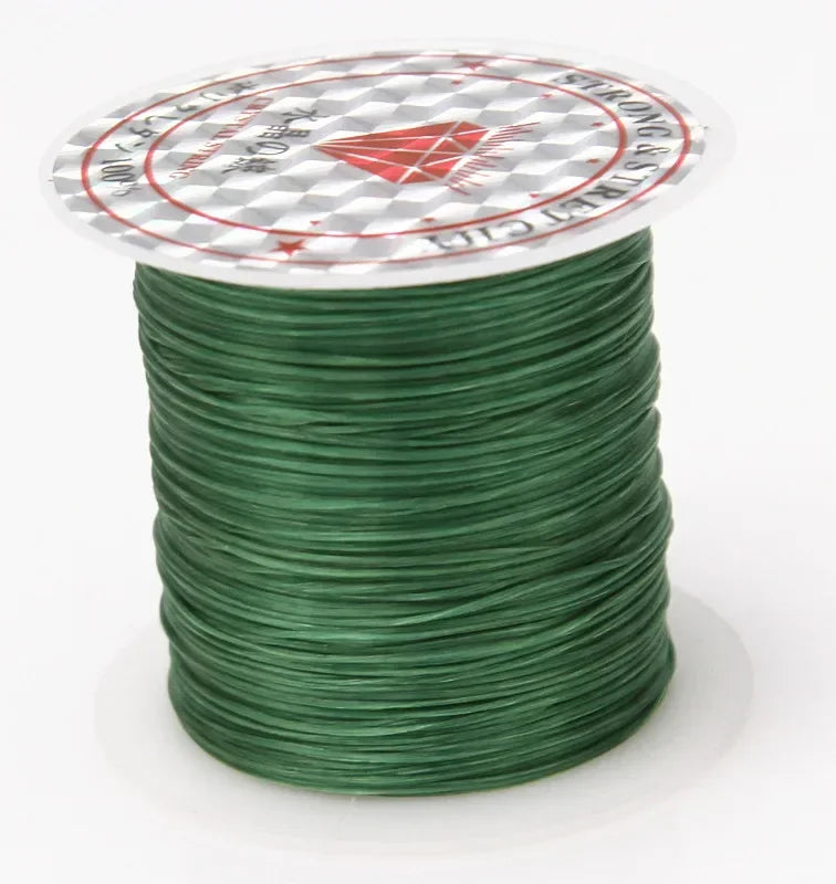 Spool of green wire with a brand label on a white background