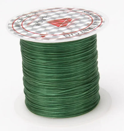 Spool of green wire with a brand label on a white background