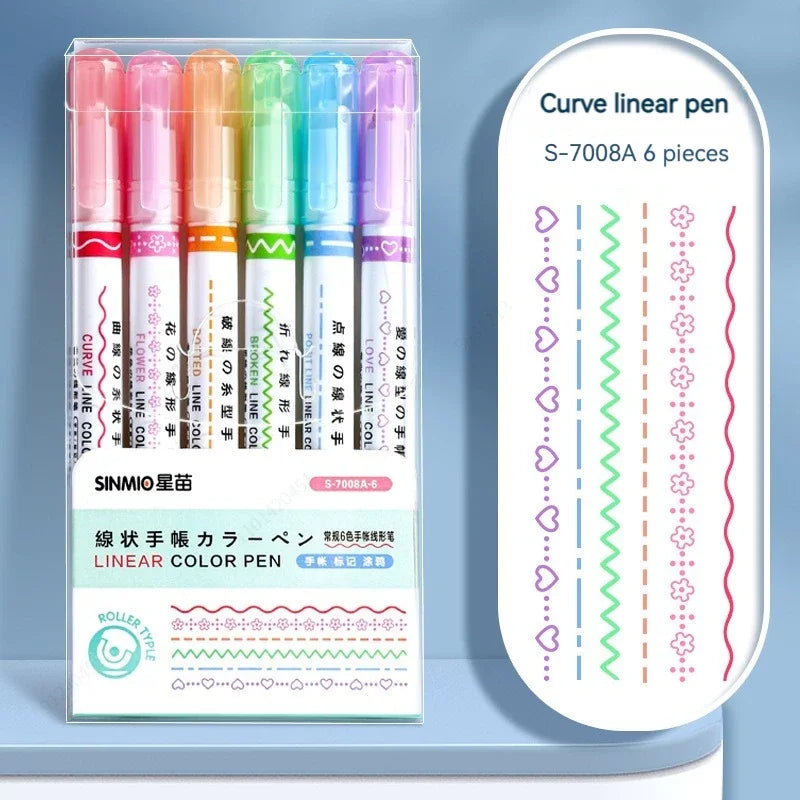 Set of six colorful linear color pens in a clear plastic case on a light blue background.