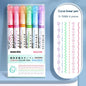 Set of six colorful linear color pens in a clear plastic case on a light blue background.