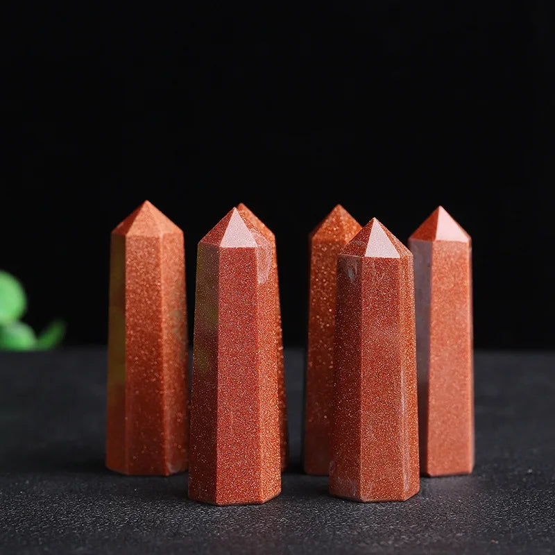 Five red crystal points on a black background