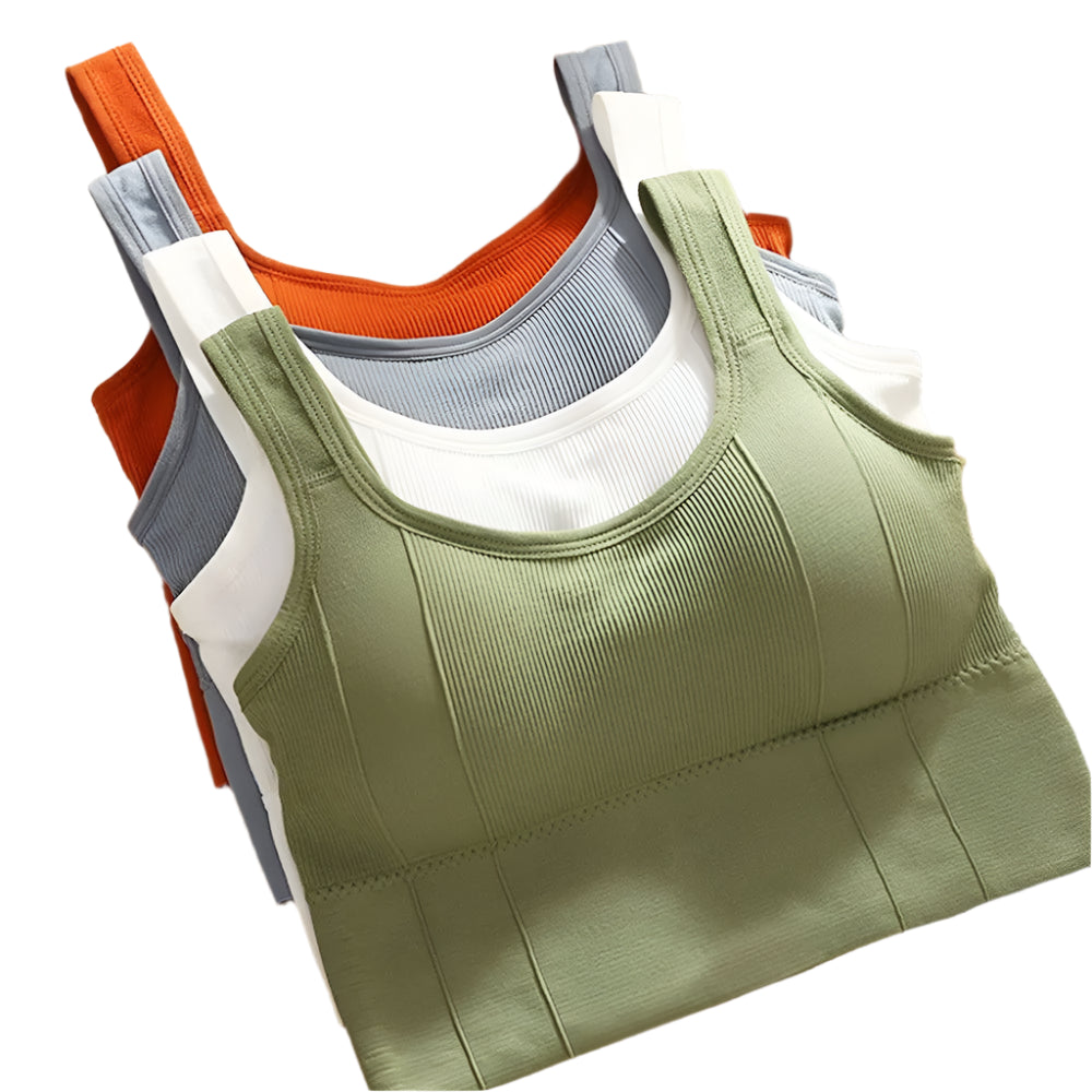 Stack of green, orange, gray, and white tank tops on a cork board background.