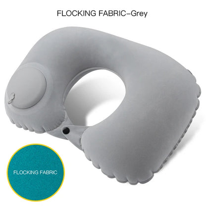 Gray inflatable neck pillow with flocking fabric feature on a white background