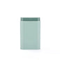 Rectangular light blue container with a green lid on a white background