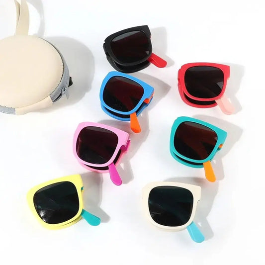 Colorful children's sunglasses on a white background
