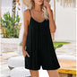 Woman wearing a black slip dress in a casual outdoor setting