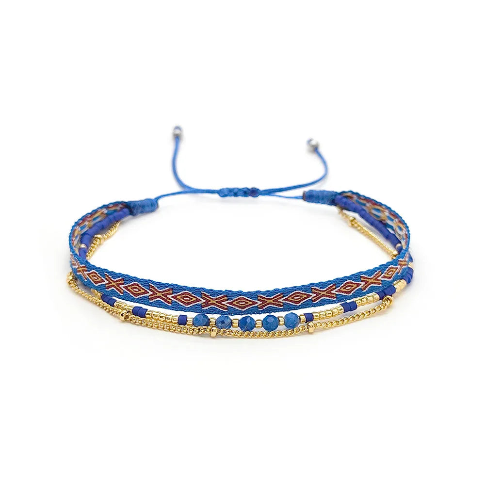 Blue and gold bracelet on a white background