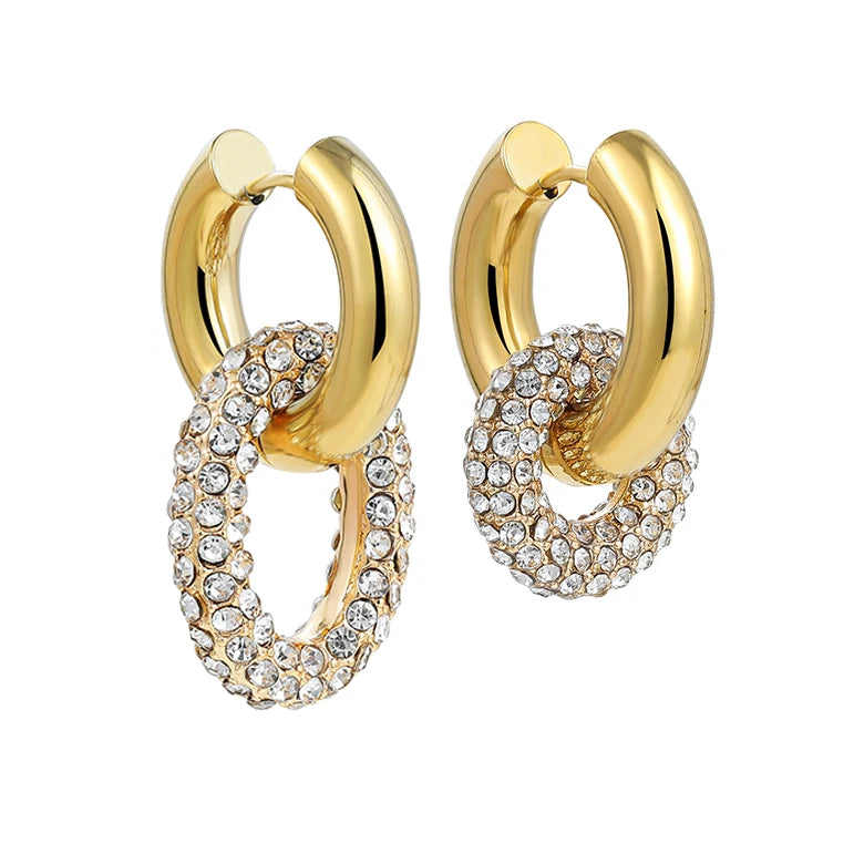 Gold hoop earrings with crystal embellishments on a white background