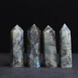 Four crystal points on a dark background