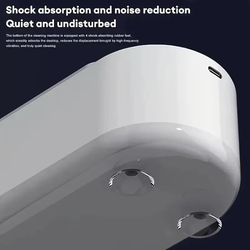 Close-up of a cleaning machine with shock absorption and noise reduction features on a dark background.