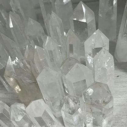Close-up of clear crystal formations on a neutral background