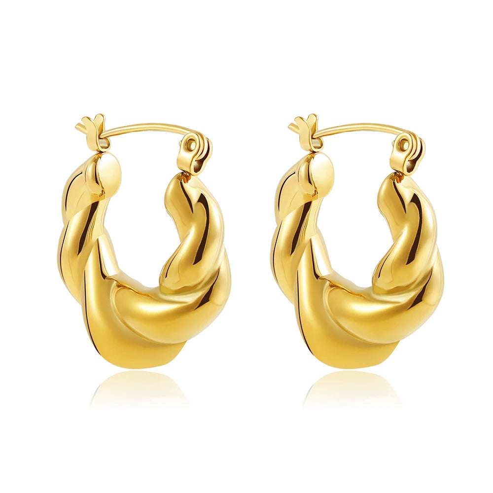 Gold hoop earrings on a white background