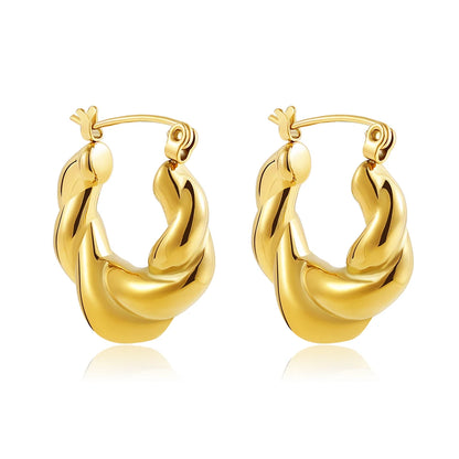 Gold hoop earrings on a white background